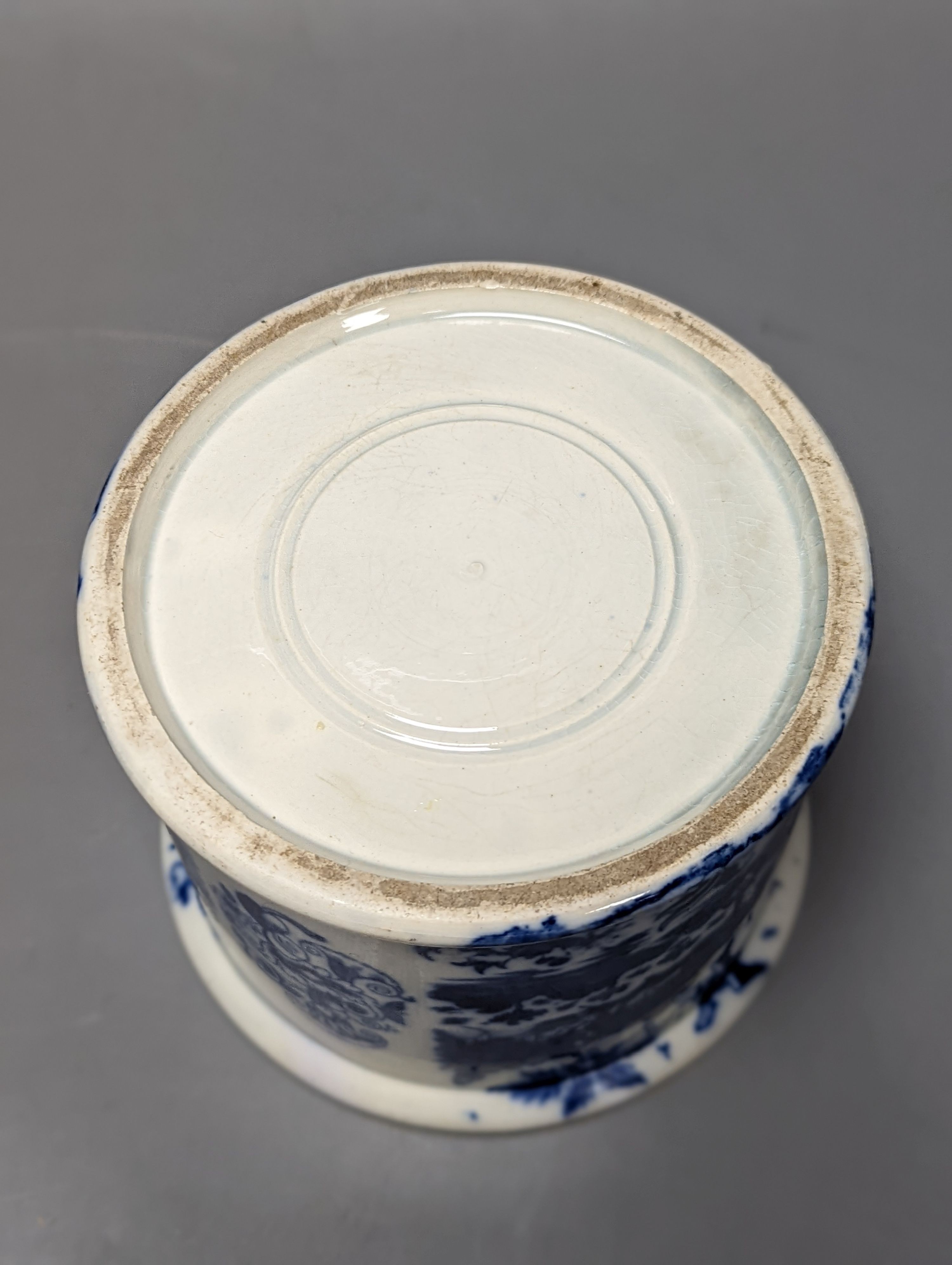 Four items of early 19th century blue and white pearlware pottery, an 18th century Delft blue and white vase and a 19th century toothbrush holder, Delft vase 22 cms high.